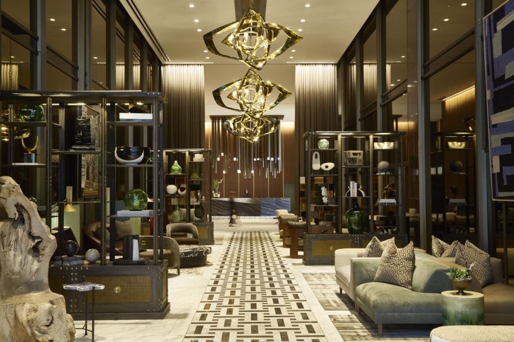 an image of the ground-floor lobby of the renovated Thompson Dallas Hotel within The National tower