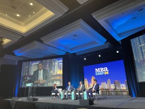 CNBC's Diana Olick leads a panel discussion with Matt Mercier from Digital Realty, Ankit Patel of BioMed Realty and Nuveen's Chad Phillips. Photo by Gabriel Frank