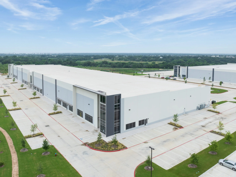 Aerial shot depicting one of the buildings within Jackson-Shaw's CrossPoint master-planned industrial development in Georgetown, Texas. 