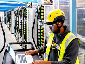 Generic image of a data center technician at work.