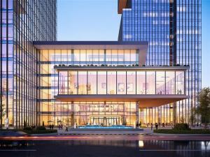 Exterior shot depicting the lower levels of large residential buildings next to a low-rise commercial property.