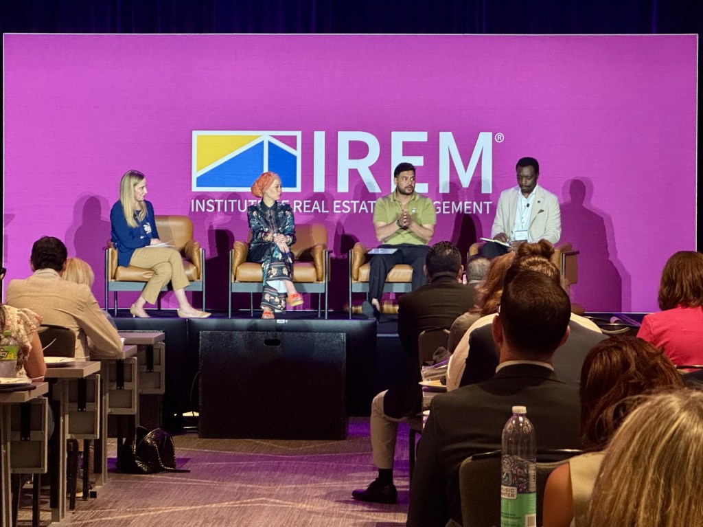 Four speakers at a panel at PropertyCon