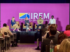 Four speakers at a panel at PropertyCon