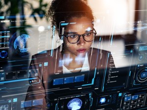 Woman at a terminal working on computer