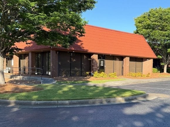 Exterior shot of a shallow bay industrial building in metro Atlanta, pat of a recent portfolio acquisition made by Basis Industrial