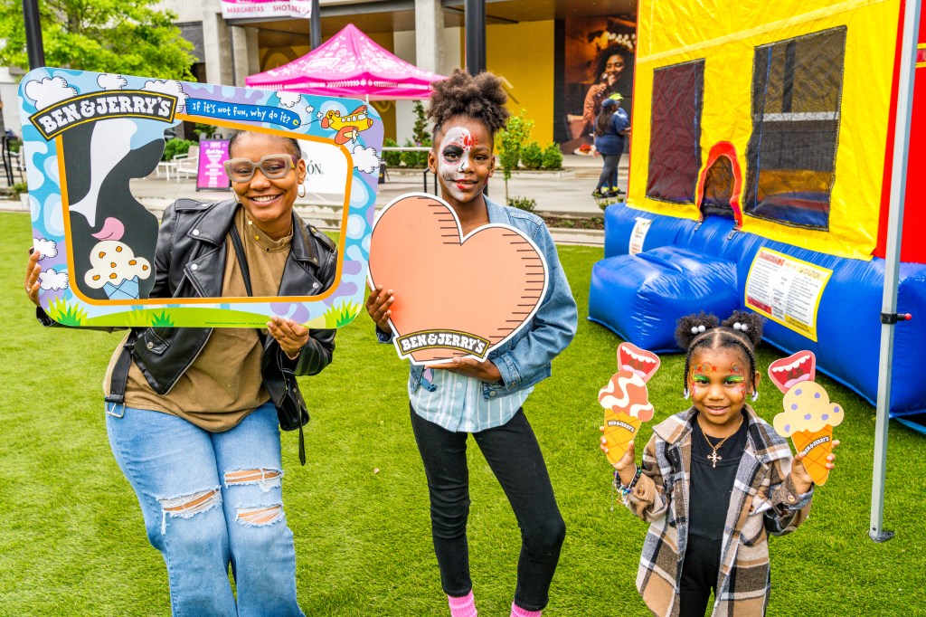 Three children in an outside space, celebrating Cinco de Mayo at High Street in Atlanta