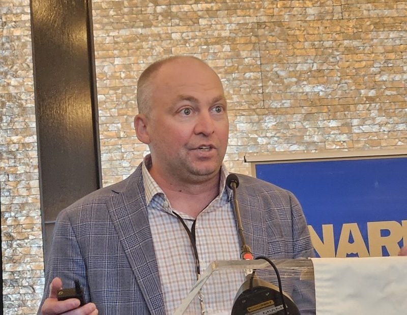 Matt Mowell, senior managing economist at CBRE, presents during NAREE's 2026 conference. Photo by Suzann D. Silverman