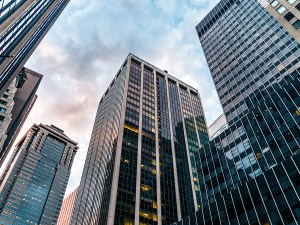 Worm's eye view of office buildings in New York City.