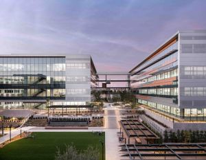 Two-building San Diego office campus at twilight under lavender sky