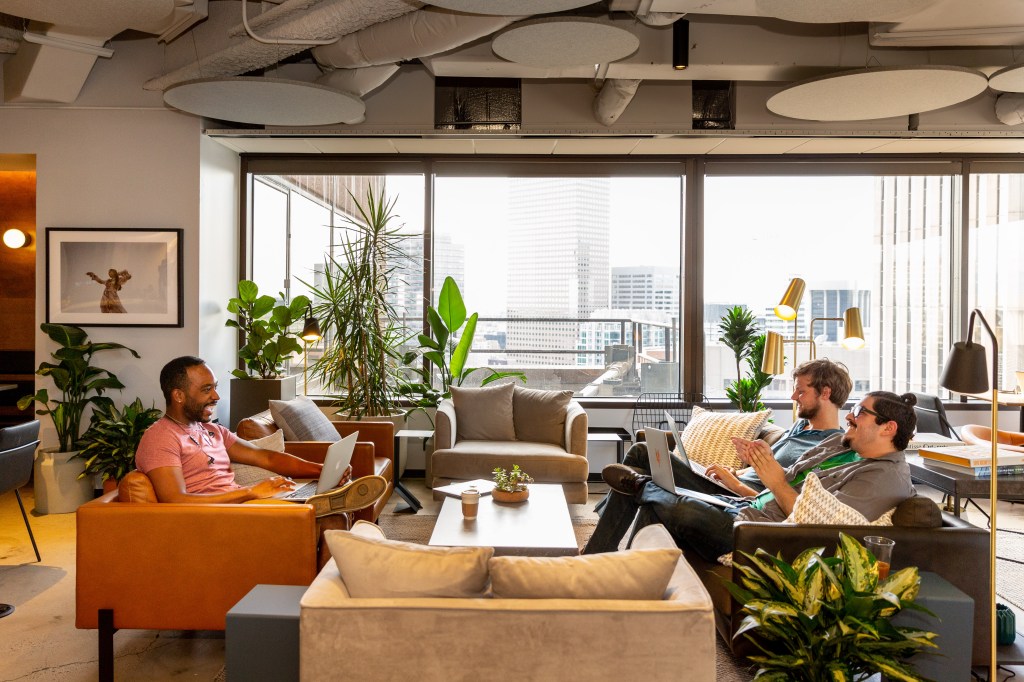 Versatility is often top of mind when it comes to redesigning common areas or collaboration spaces in office settings. Image courtesy of Industrious via CBRE