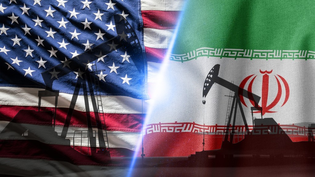 Oil Pump Jacks Overlaid with United States and Iran Flags Symbol. Image by Nixartmd/Adobe Stock