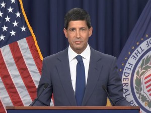 A photo of Federal Reserve Chair Kevin Warsh speaking at a news conference.