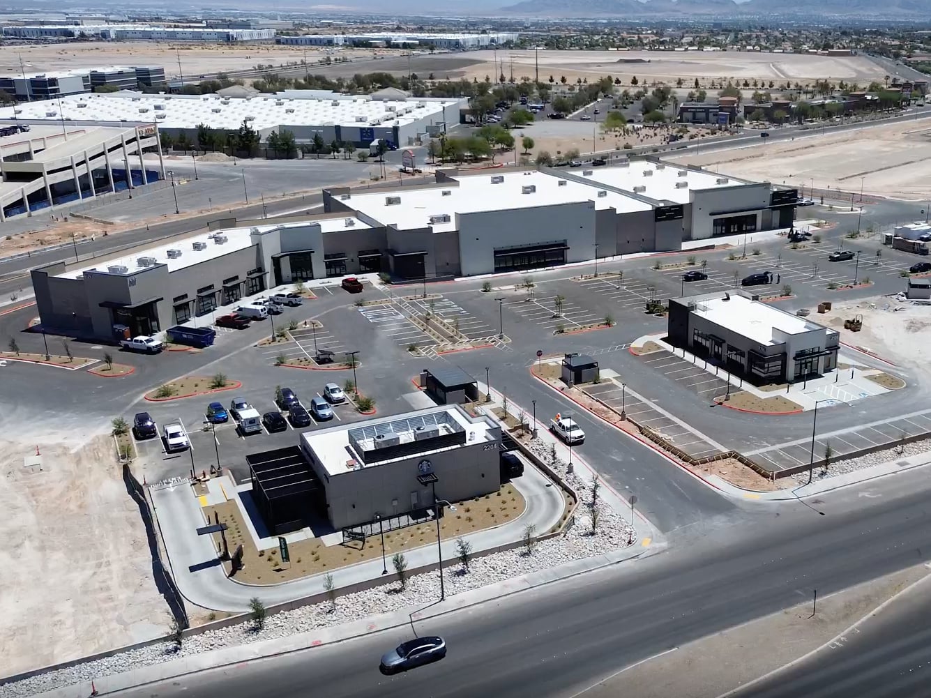 Drone shot depicting the Hylo Park South, a grocery-anchored retail shopping center in North Las Vegas, Nevada.