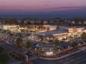 An aerial rendering of The Cliff retail center at night.