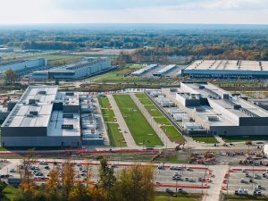 Generic image with an aerial view of a data center campus with multiple buildings.