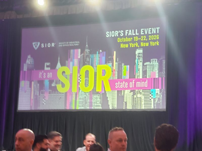 Large sign saying It's an SIOR state of mind against a black background