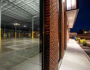 Brick and glass entrance of a new industrial building