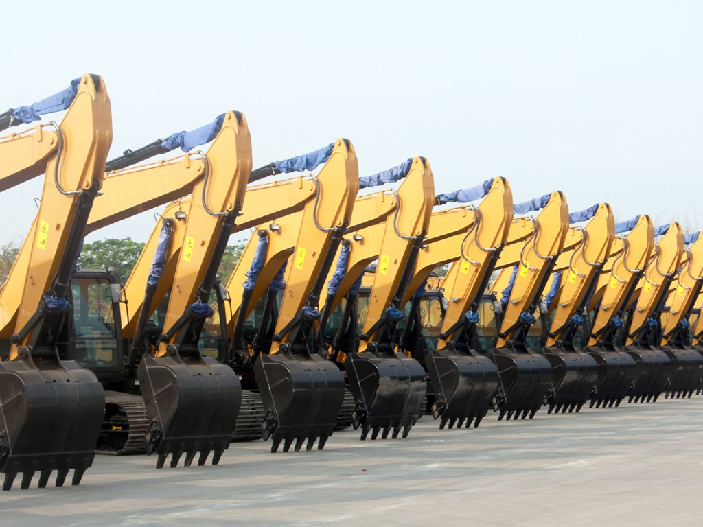 New Excavators are lined up in a parking lot