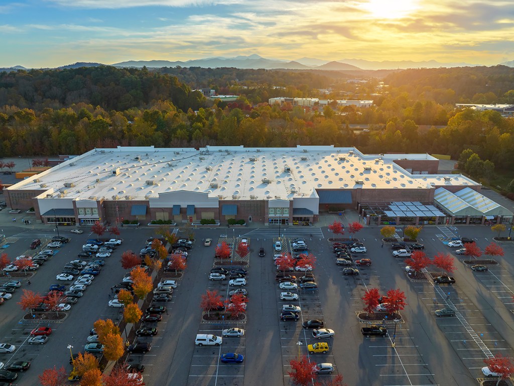 Aerial shot of a retail center with parking lot. 